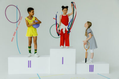 Girls standing on an olympic podium stand